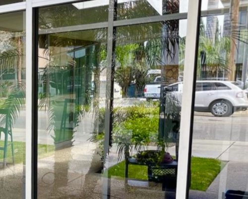 crystal clear glass after hard water stain removal treatment for nail salon in Irvine spectrum